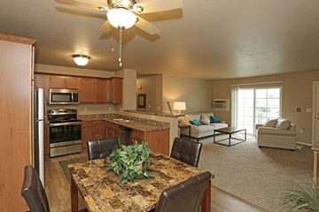 Oshkosh apartment for rent - a kitchen and living room with a table