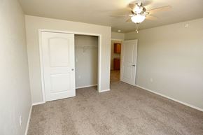 Appleton apartment for rent - an empty bedroom with a closet and a ceiling fan