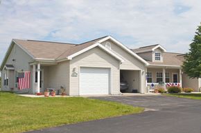 Fond Du Lac apartment for rent - a white house with an flag on the side of it