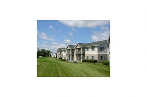 Sheboygan Falls apartment for rent - A large house with a lawn in front.