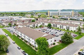 La Crosse apartment for rent - A large white building with a parking lot in front.