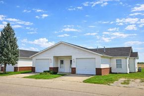 Rock Falls apartment for rent - A two-car garage with a white door and a brick pillar.