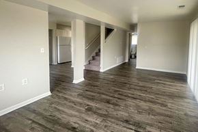 Bangor apartment for rent - A spacious room with a staircase leading to another floor.