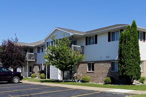 Neenah apartment for rent - an apartment building with a truck parked in front of it