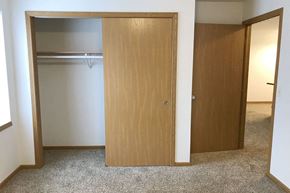 Rothschild apartment for rent - a bedroom with a closet and an open door