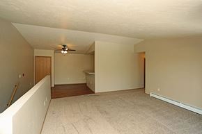Rhinelander apartment for rent - an empty living room with a ceiling fan