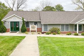 Gosport apartment for rent - a white house with a green door and a lawn