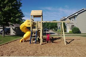 Northfield apartment for rent - a playground with a yellow slide and a