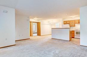 Portage apartment for rent - an empty living room and kitchen with a white floor