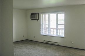 Random Lake apartment for rent - an empty room with a window and a air conditioner