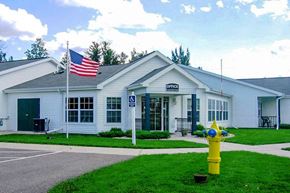 Wisconsin Rapids apartment for rent - a white building with a yellow fire hydrant in front of it
