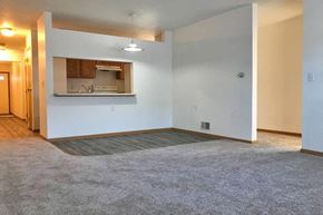 Ladysmith apartment for rent - an empty living room with a kitchen in it