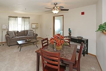 Green Bay apartment for rent - a living room and dining room with a table and chairs