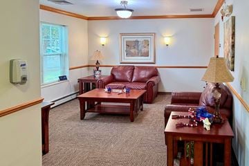 Fond Du Lac apartment for rent - A living room with a red couch and a brown coffee table.