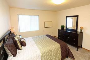 Appleton apartment for rent - a bedroom with a bed and a dresser