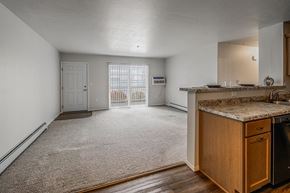 Plover apartment for rent - A kitchen area with a counter and a refrigerator.