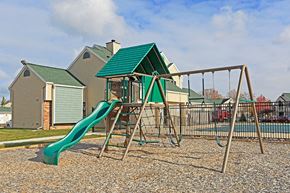 Port Huron apartment for rent - a swing set with a slide in a playground