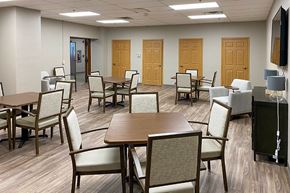 Greenfield apartment for rent - A conference room with a long table surrounded by chairs.