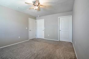 Portage apartment for rent - an empty room with two doors and a ceiling fan