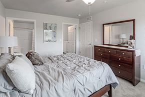 Merrill apartment for rent - a bedroom with a bed and a dresser