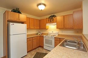 Ripon apartment for rent - a kitchen with a stove refrigerator and a sink