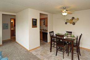 Beloit apartment for rent - an empty dining room with a table and chairs