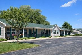Fond Du Lac apartment for rent - A small building with a green roof and white walls.