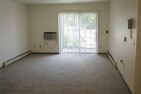Sturgeon Bay apartment for rent - an empty room with a heater and a window