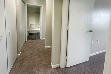 Bangor apartment for rent - A small bedroom with a bed and a sink.