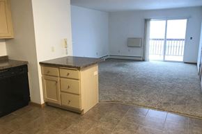 Rothschild apartment for rent - an empty kitchen and living room with a counter in the middle