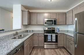 Harrison apartment for rent - a kitchen with granite counter tops and stainless steel appliances
