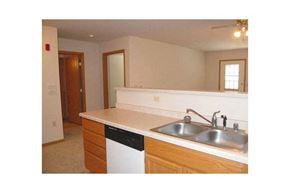 South Milwaukee apartment for rent - A kitchen with a white counter top and a dishwasher.