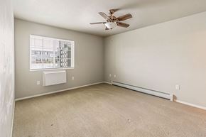 Plover apartment for rent - Empty room with a ceiling fan and a window.