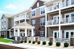 Beaver Dam apartment for rent - an apartment building with a porch and balconies