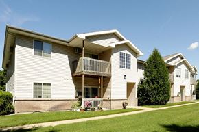 Stevens Point apartment for rent - a white house with a balcony and a yard