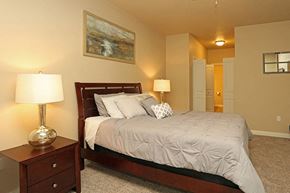 Sheboygan apartment for rent - a bedroom with a bed and two lamps