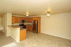 Rhinelander apartment for rent - an empty kitchen with a stainless steel refrigerator