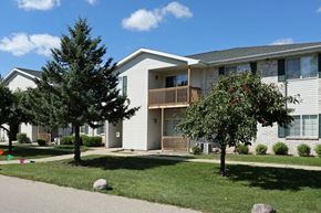 Neenah apartment for rent - an apartment building with two trees in front of it