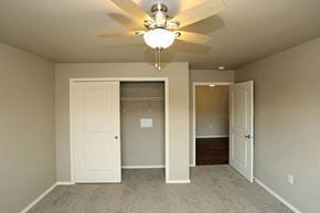 Rhinelander apartment for rent - a bedroom with a ceiling fan and a closet