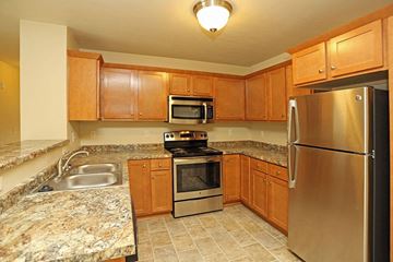 Rhinelander apartment for rent - a kitchen with granite counter tops and stainless steel appliances