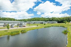 Reedsburg apartment for rent - a body of water next to a building