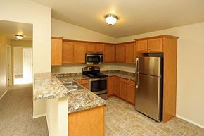 Rhinelander apartment for rent - a kitchen with stainless steel appliances and granite counter tops