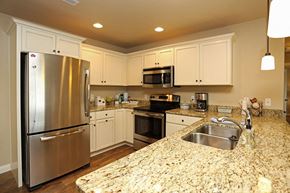 Sister Bay apartment for rent - a kitchen with granite counter tops and stainless steel appliances