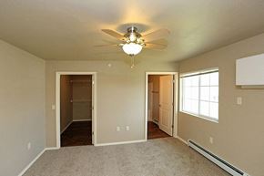 Rhinelander apartment for rent - an empty living room with a ceiling fan