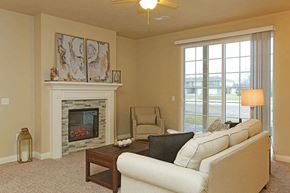 Sheboygan apartment for rent - a living room with a couch and a fireplace