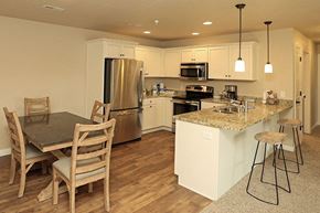 Sister Bay apartment for rent - a kitchen with an island and a table with chairs