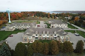 Sister Bay apartment for rent - an aerial view of a large building with a water tower