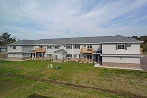 Rhinelander apartment for rent - a large house with a yard in front of it