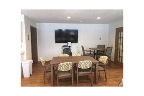 St. Francis apartment for rent - a dining room with a table and a television