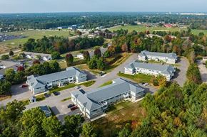 Wisconsin Rapids apartment for rent - A bird's eye view of a large building surrounded by trees.